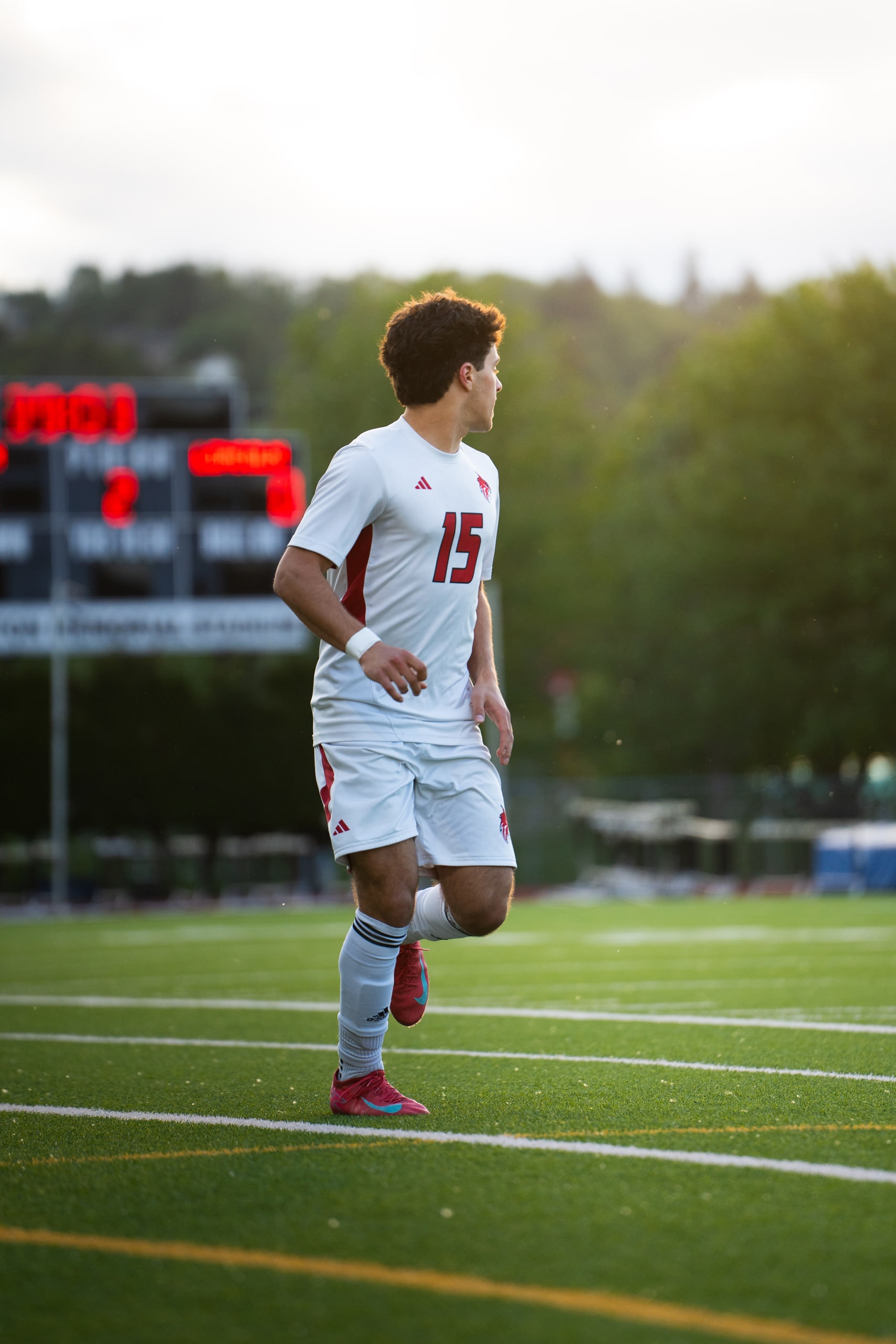 A player in a number 15 shirt walking back upfield